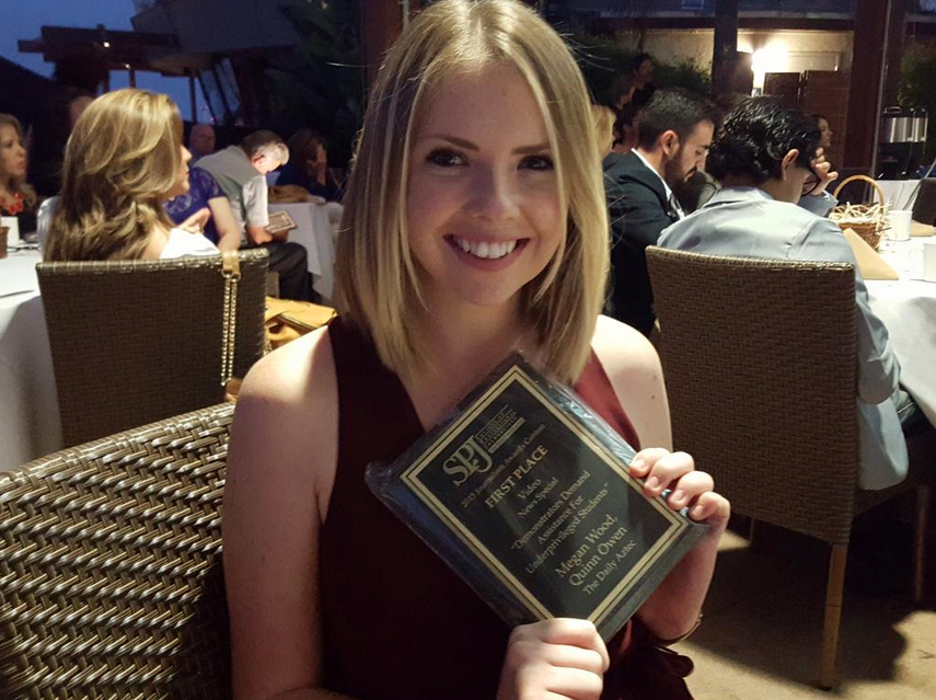 Megan Wood, inewsource photography intern, shows off her award at the 2015 San Diego SPJ Awards.