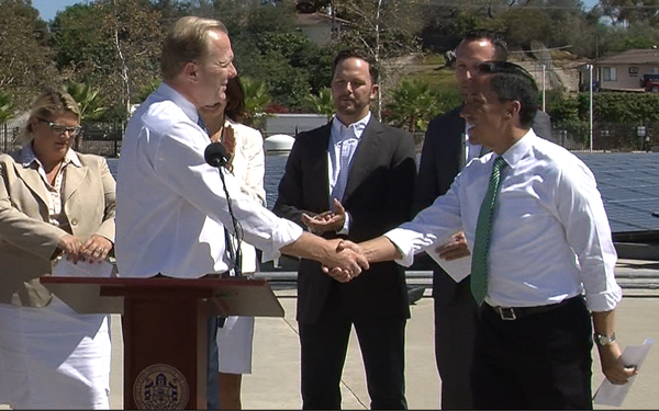 San Diego Mayor Kevin Faulconer shakes the hand of Council President Todd Gloria at a press conference unveiling the mayor's climate action plan, Sept. 30, 2014. Tarryn Mento, KPBS