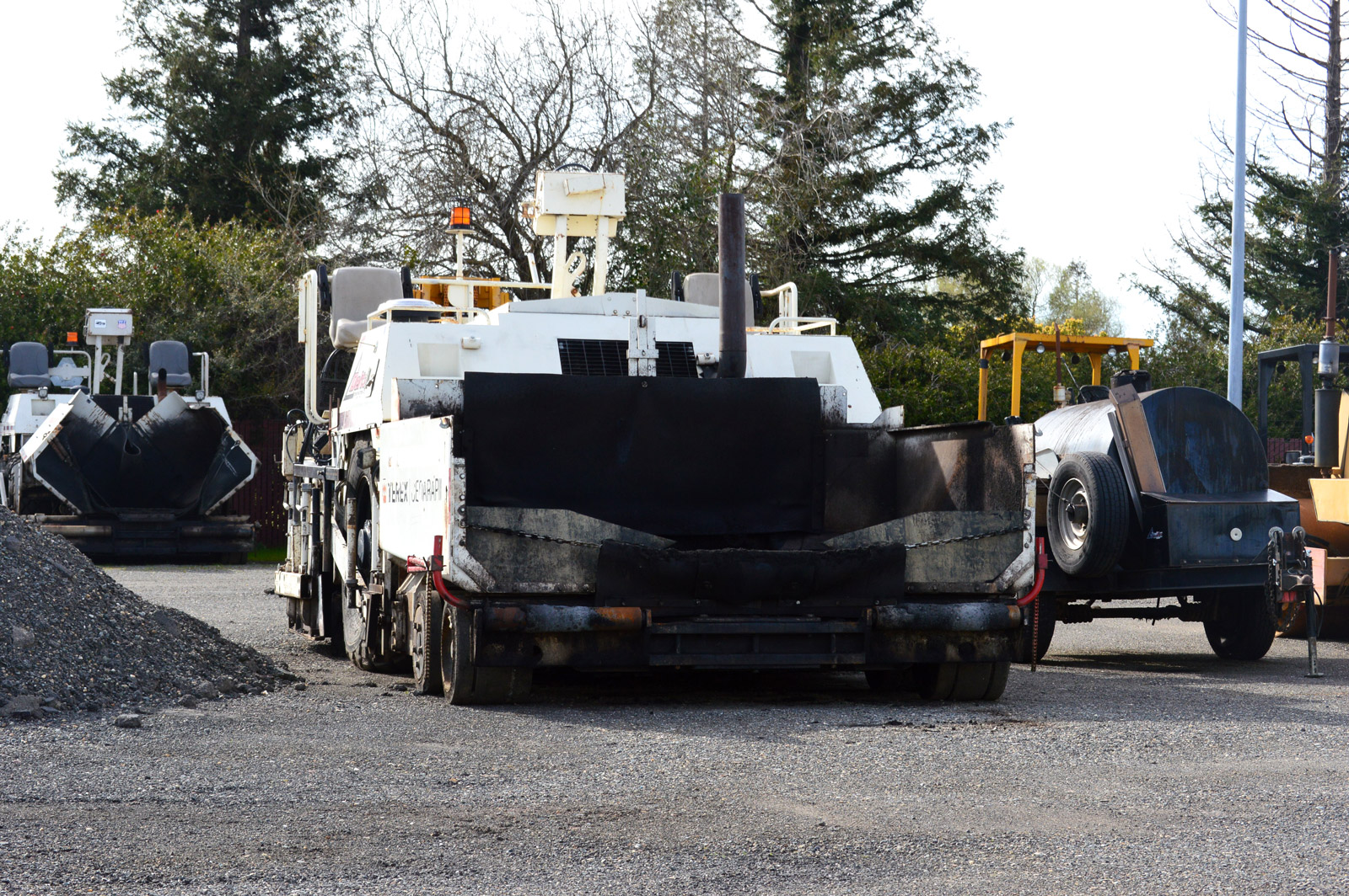 A highway paving machine in the yard of Skip Brown, whose Delta Construction company is a plaintiff in a lawsuit challenging a California diesel exhaust rule. March 9, 2017. Ingrid Lobet, inewsource