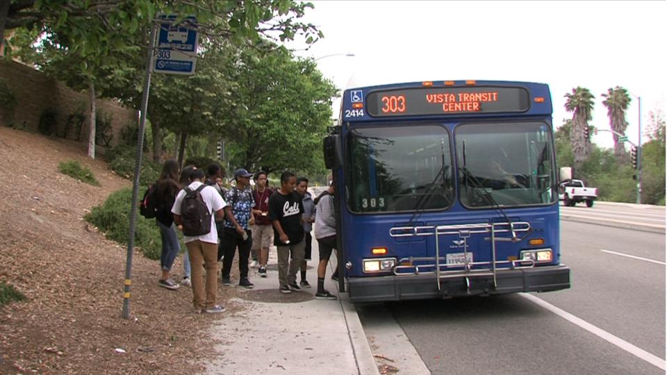 Roosevelt Middle School students board a North County Transit District Bus on North Santa Fe Avenue in Vista, June, 6, 2017. (Video screenshot by Katie Schoolov/KPBS)
