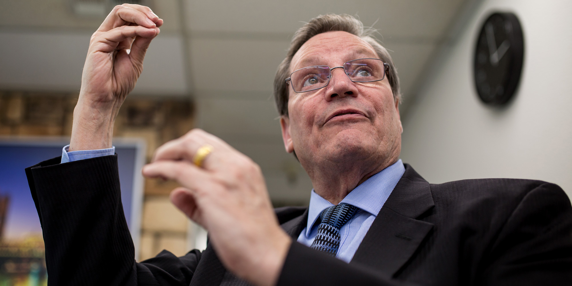 Ford Gilbert, founder and CEO of Trina Health, is shown in an office at the company’s Sacramento headquarters on Feb. 5, 2018. He is flipping through a PowerPoint presentation he uses to explain to investors the effects of the Trina IV insulin infusion procedure. (Megan Wood/inewsource)
